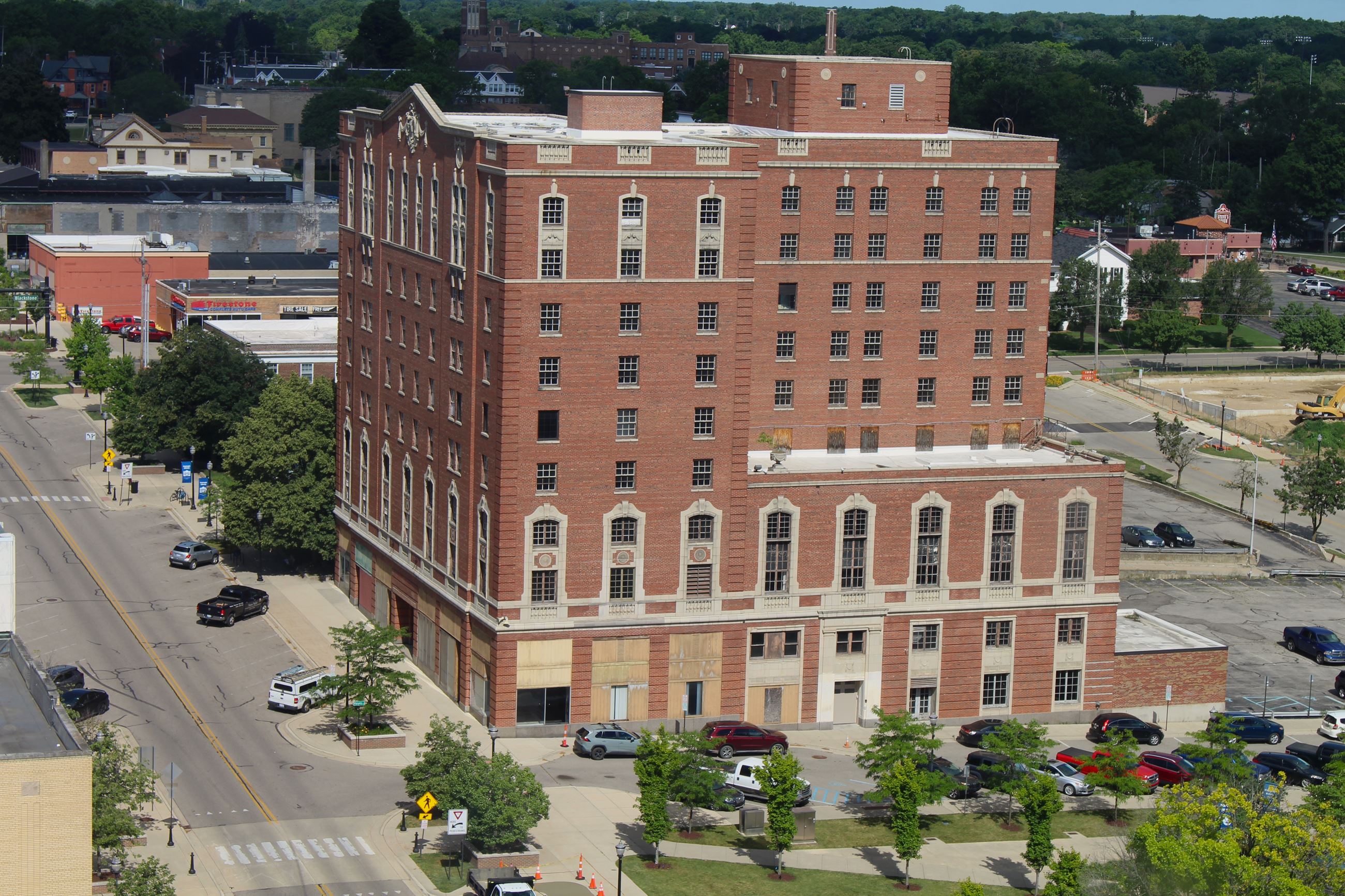 A tall large red brick building from the 1920s
