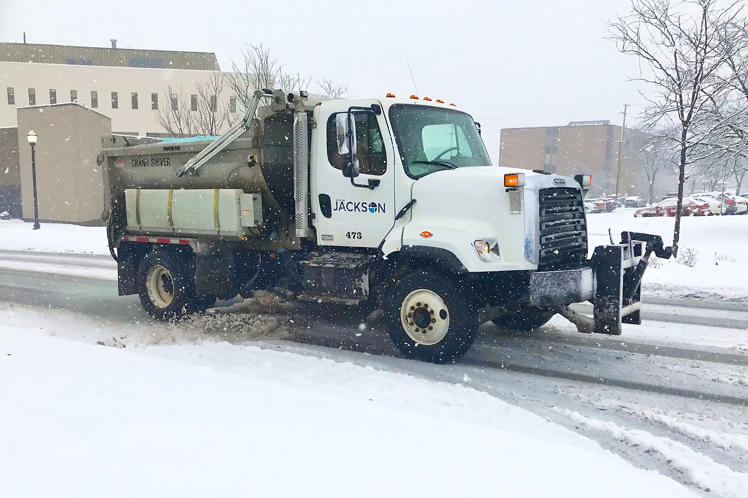 Snow plow clearing streets Jackson 2024